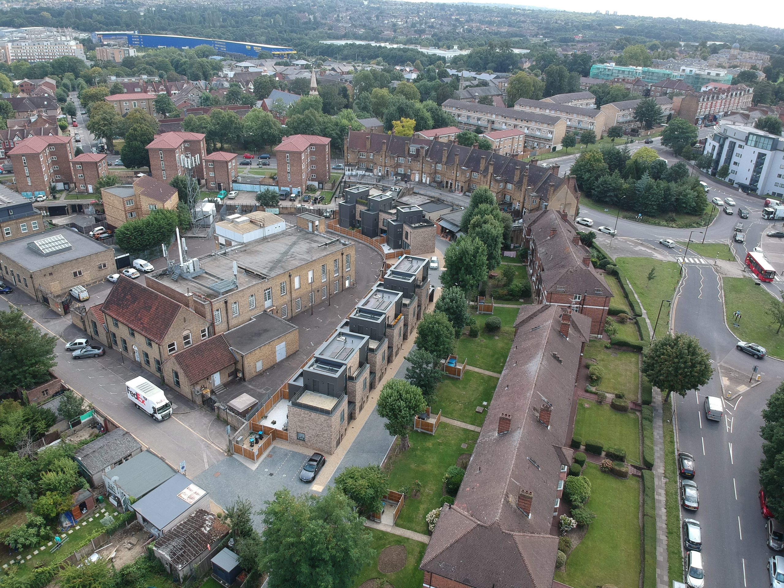 Aerial view of nine new build houses on a former garage site in north London