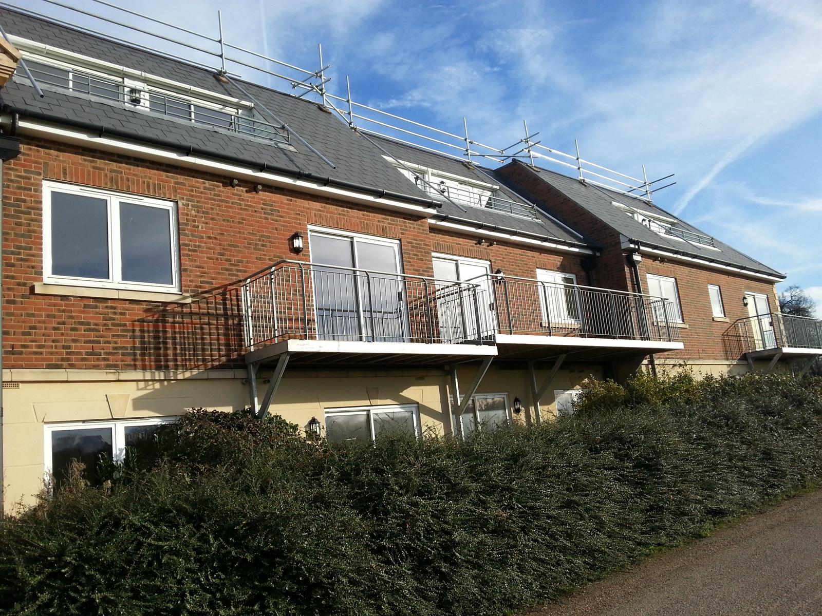 745_6 Apartment building with slate roof and steel balconies