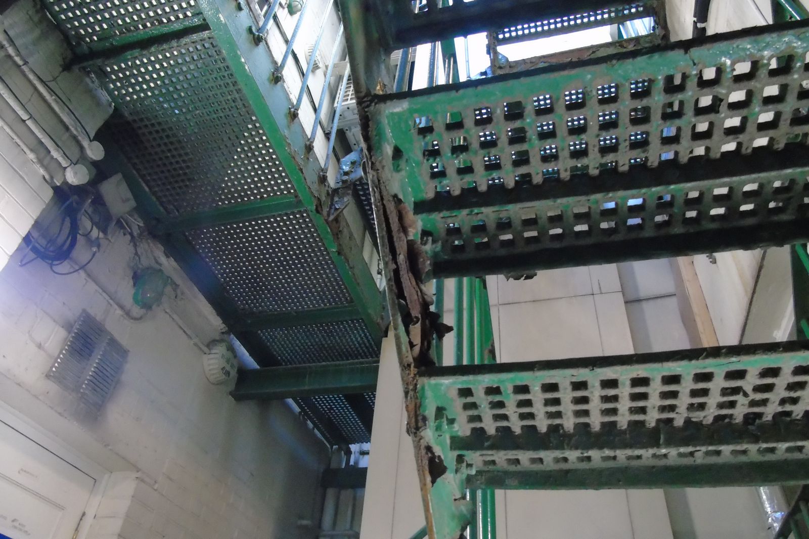 External metal escape stair in the light well before repair