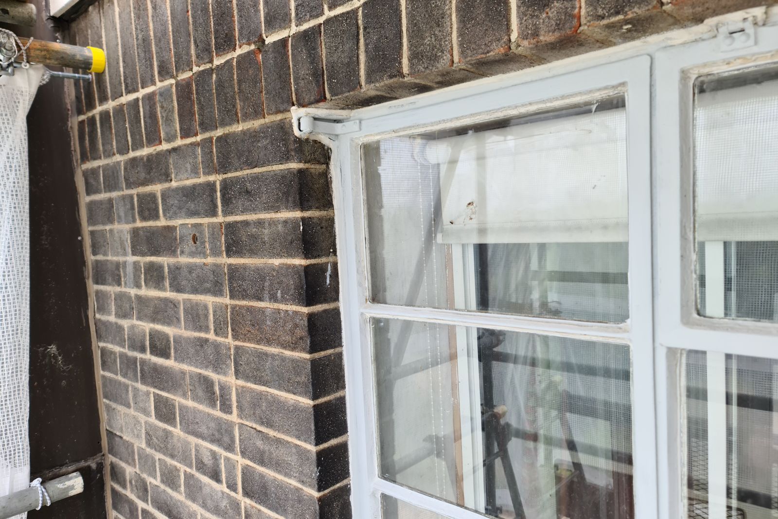 Metal window and brickwork from the scaffold during the works