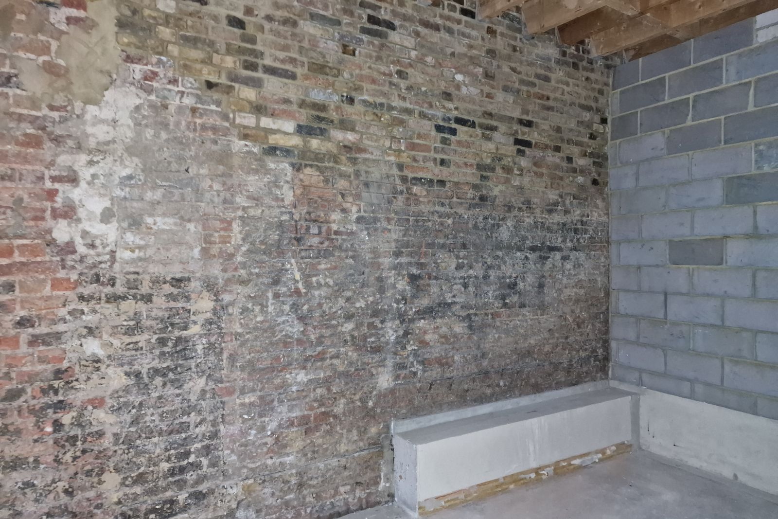 Stripped back brick wall in a vacated commercial unit