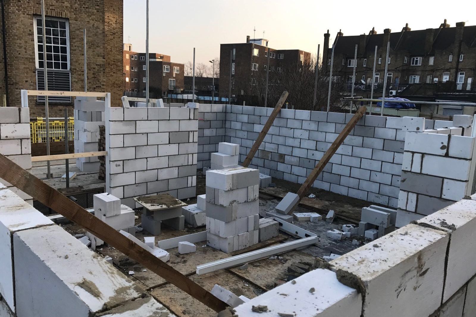 Blockwork shells of the new houses rising on the former garage site