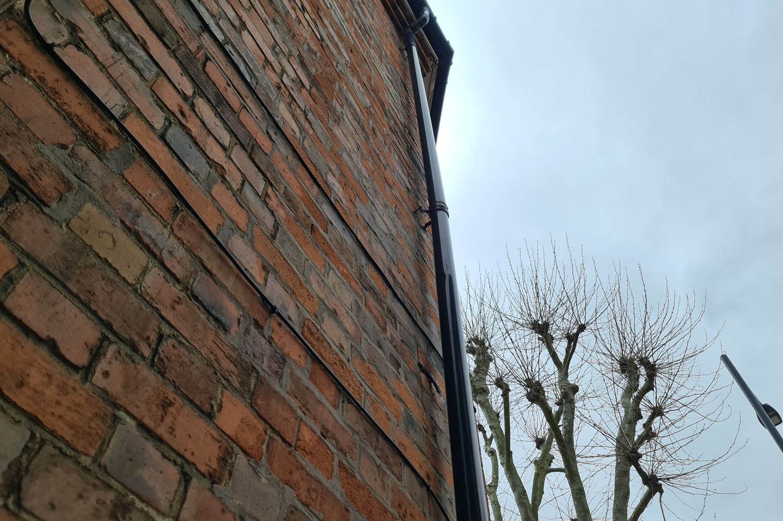 cs-period-house-brickwork Brick elevation and rainwater pipe on a period house during structural repairs