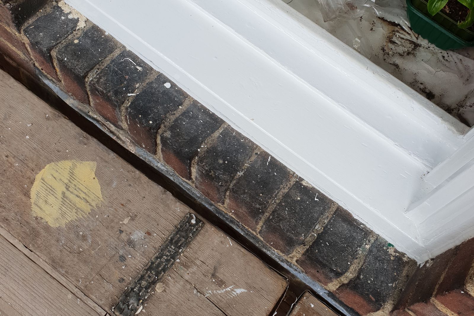 Repaired and redecorated timber sash window and sill
