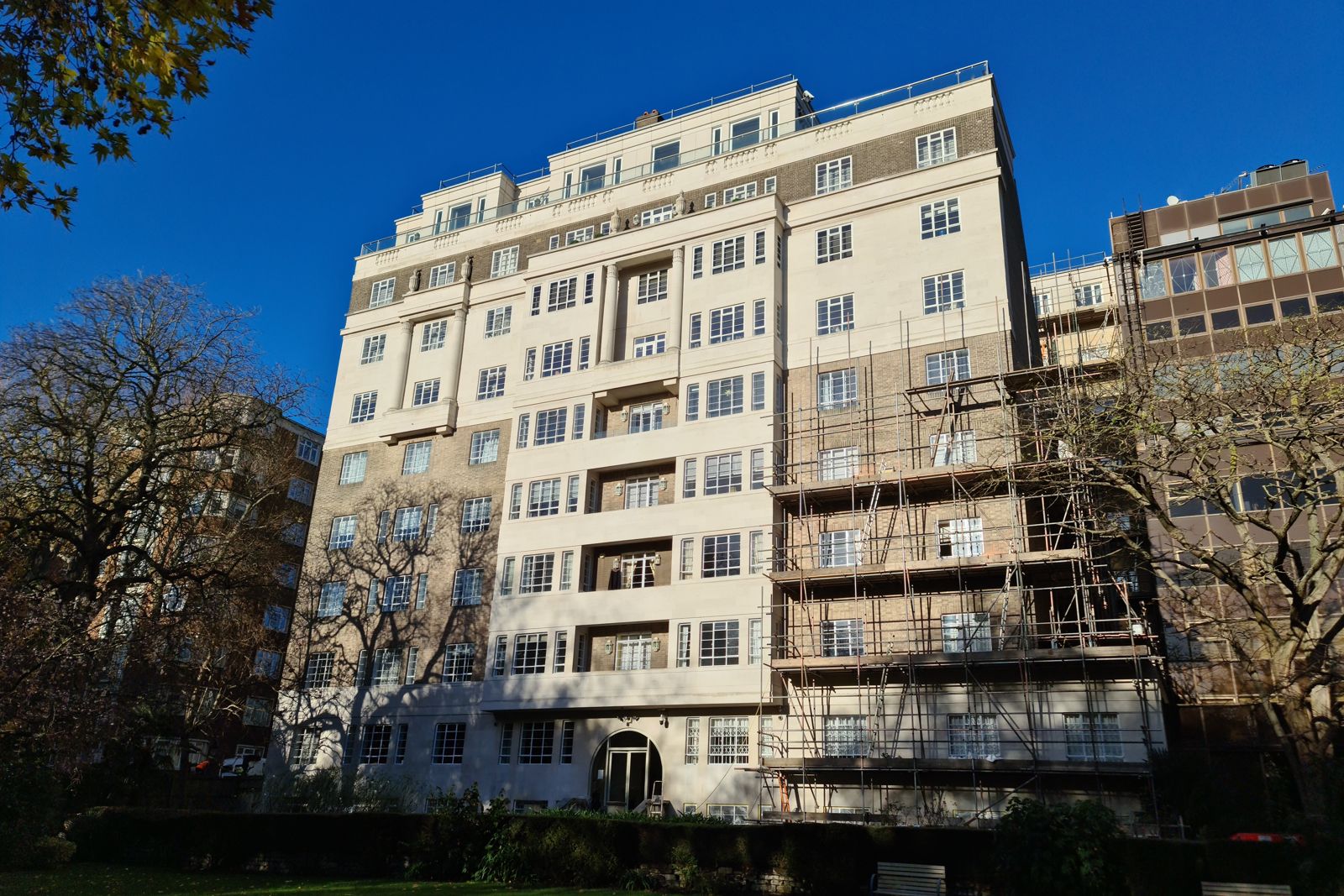 Completed rear garden façade of a 1930s mansion block in Westminster after external repairs